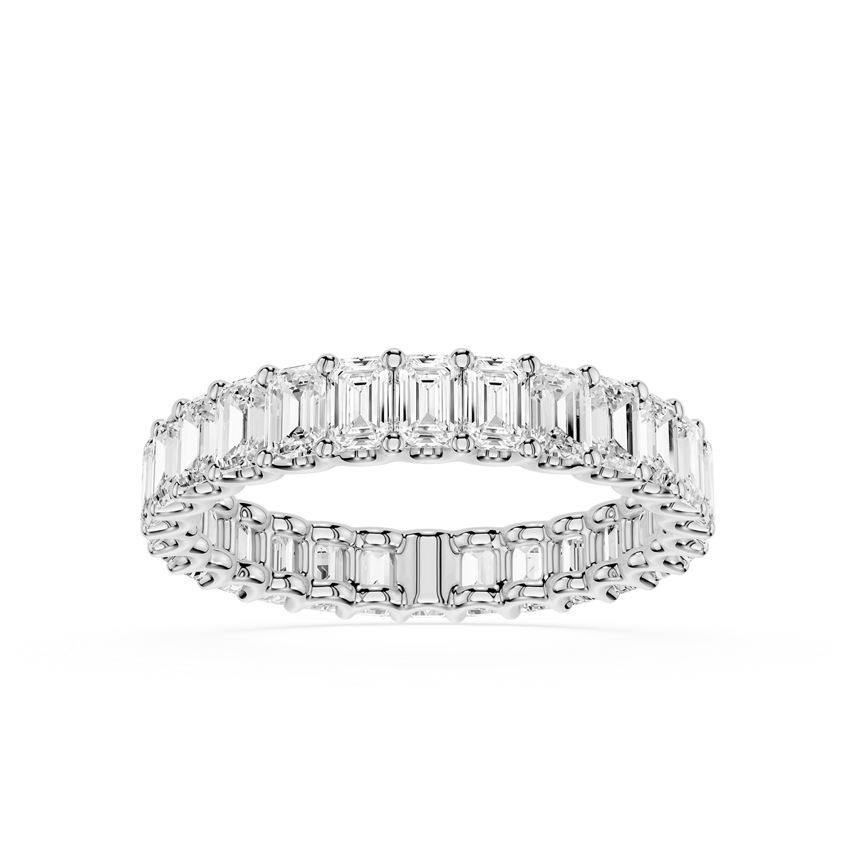 Emerald cut diamond eternity ring crafted in 18K white gold. Continuous row of lab grown diamonds in shared prong setting with clean architectural profile and refined finish.