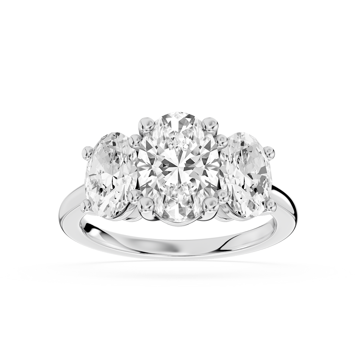 White gold three stone lab grown diamond engagement ring showcasing a large oval center diamond and matching oval side stones