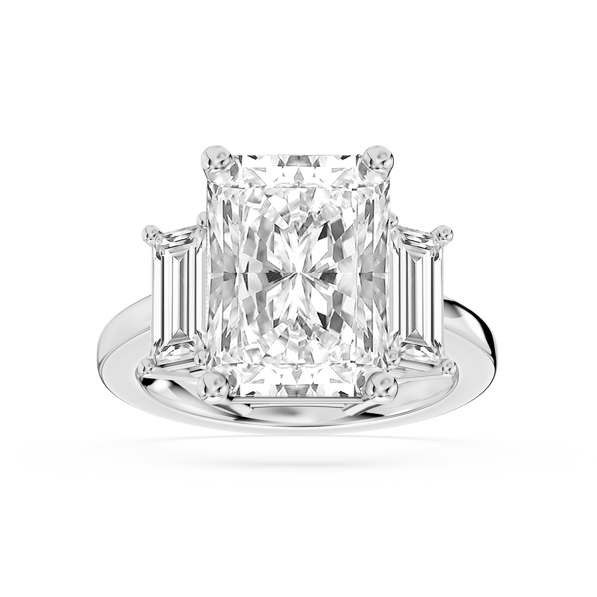 White gold three stone lab grown diamond engagement ring showcasing a radiant cut center and tapered baguette side diamonds