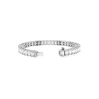 Diamond bracelet with baguette and round cut stones on a white background
