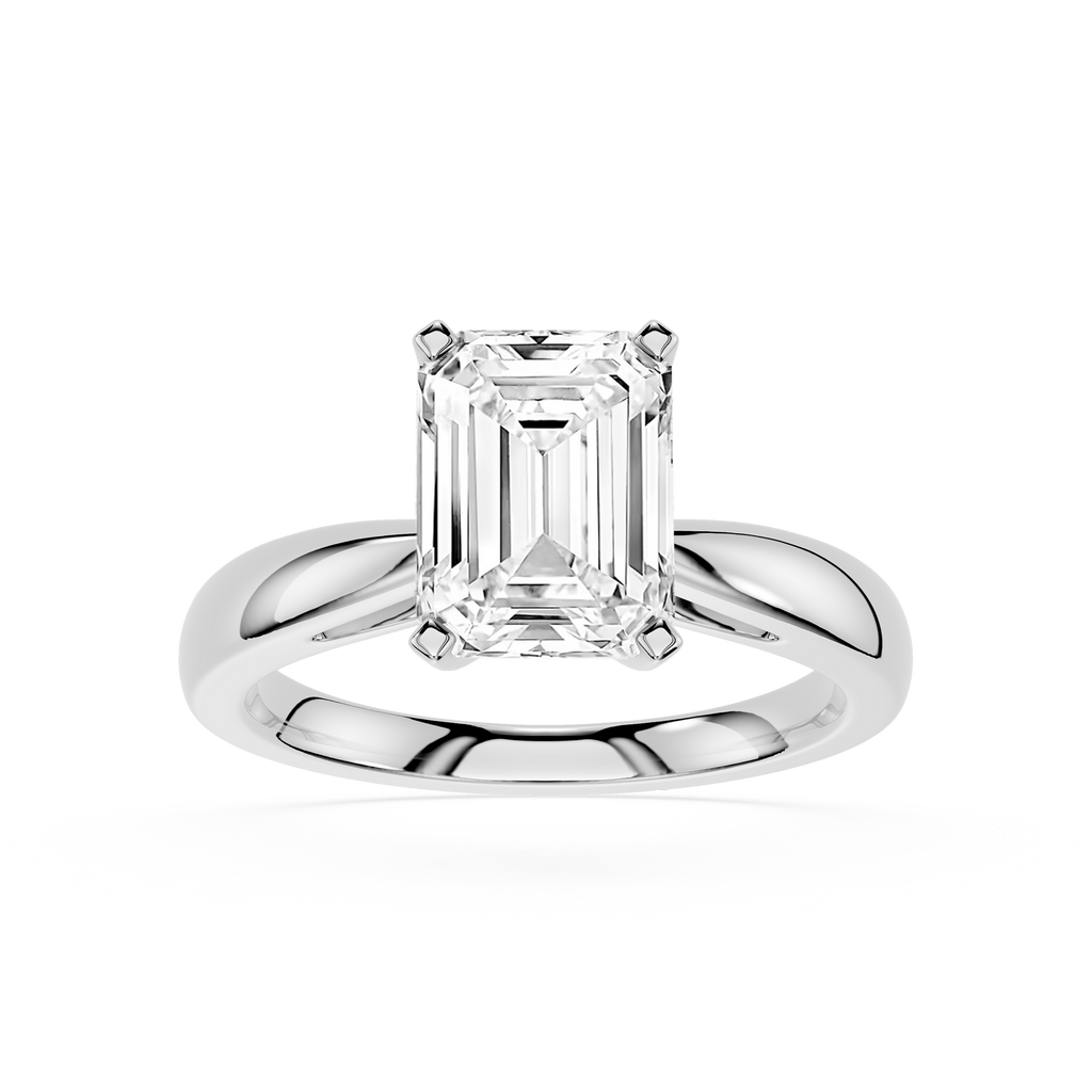 Diamond ring with emerald-cut gemstone on a white background