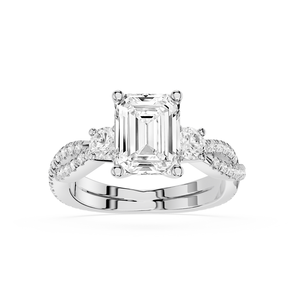 Diamond ring with emerald-cut center stone on a white background