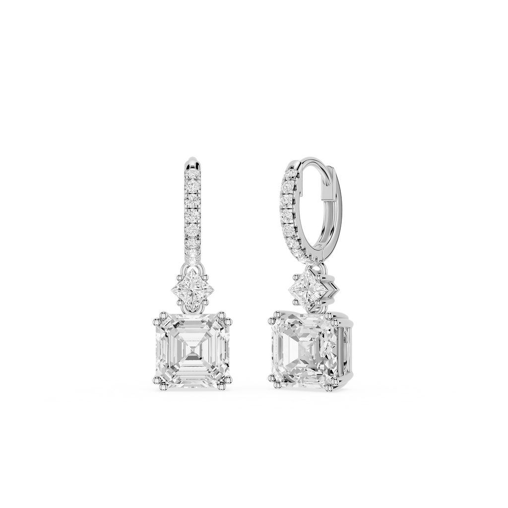 Pair of diamond earrings on a white background
