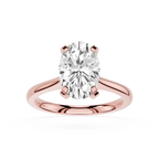 Rose gold ring with a large diamond on a white background