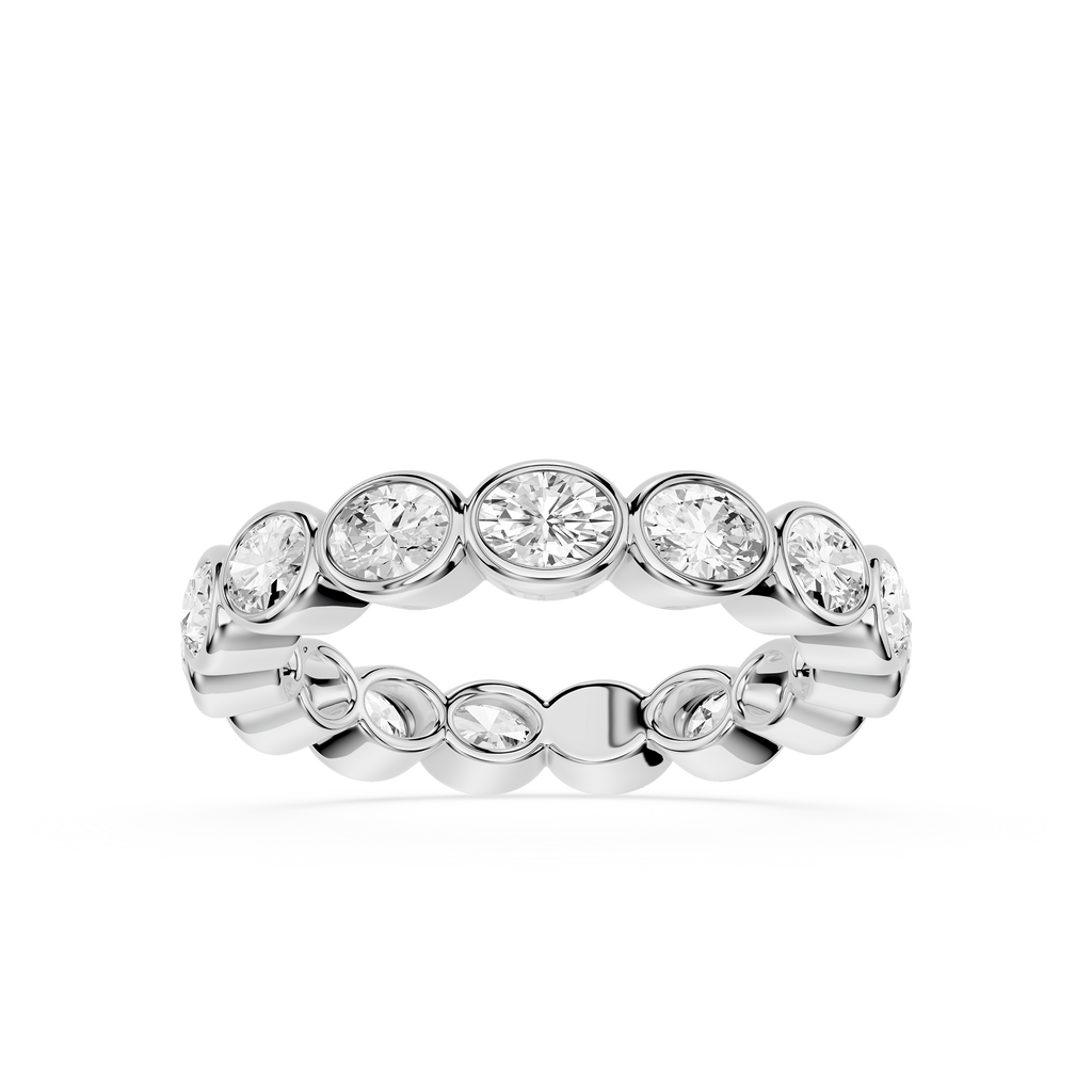 A silver-toned eternity ring featuring a row of round-cut and oval-cut clear gemstones in a prong setting, shown against a plain white background.