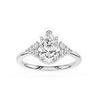 Diamond ring with pear-shaped center stone and smaller round stones on a white background