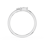 A silver-toned diamond ring shown from the back, featuring a round brilliant-cut diamond center stone and smaller side diamonds, set against a plain white background.