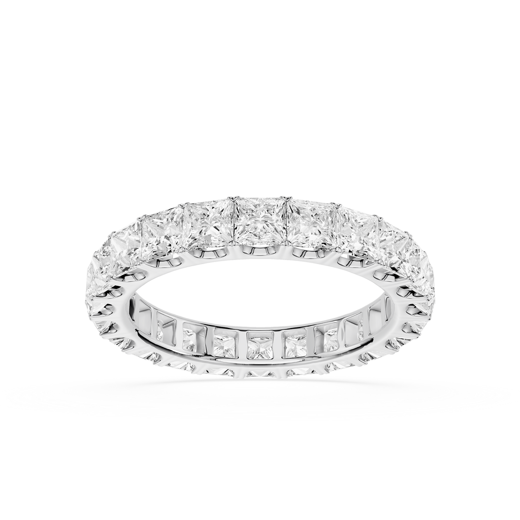 A diamond eternity band ring in white gold or platinum, featuring a continuous row of princess-cut and baguette diamonds on a clean white background.