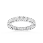 A diamond eternity band ring in white gold or platinum, featuring a continuous row of princess-cut and baguette diamonds on a clean white background.