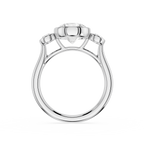 Diamond ring with a central triangle-shaped diamond and smaller diamonds on the sides on a white background