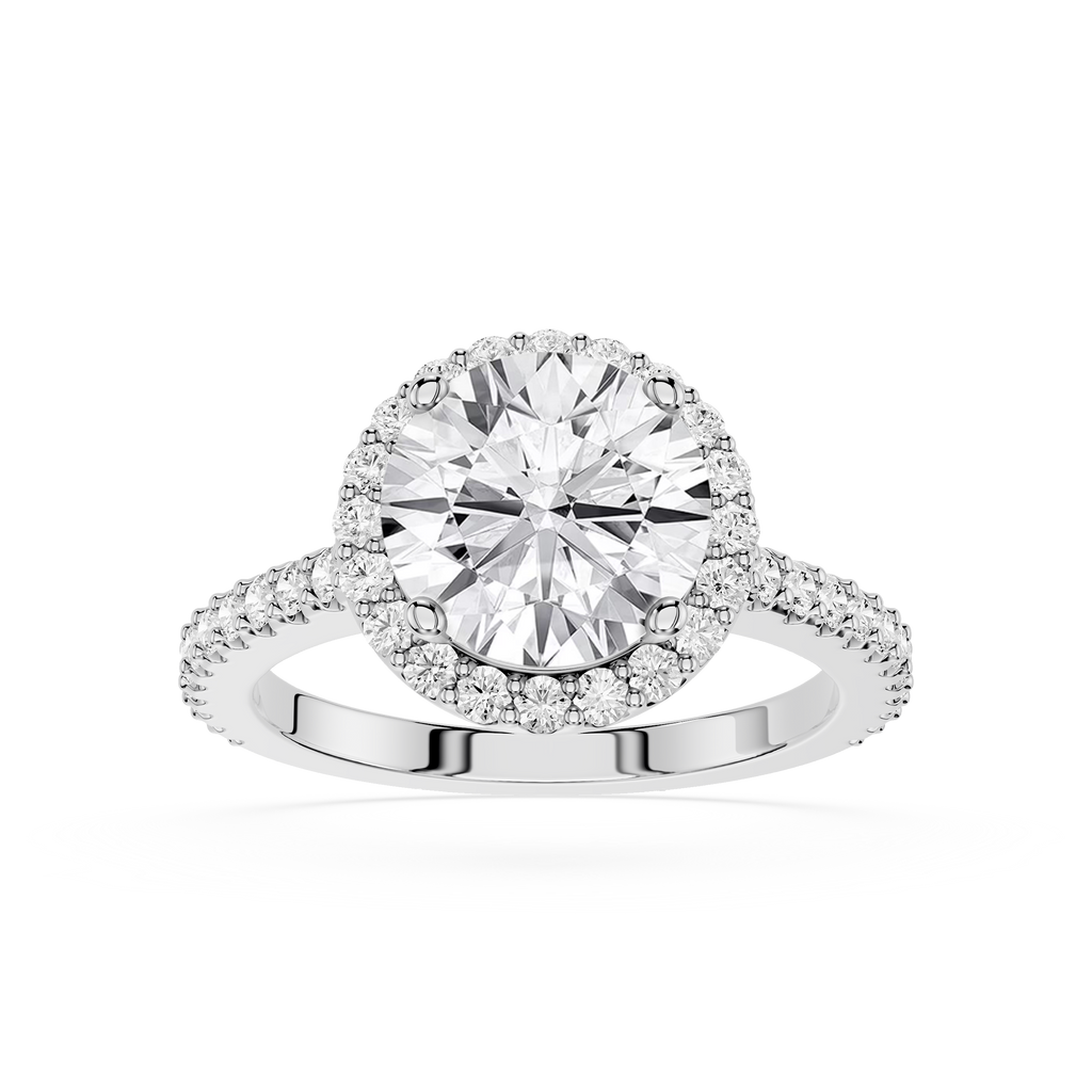 Diamond ring with a halo of smaller diamonds on a white background