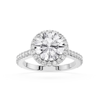 Diamond ring with a halo of smaller diamonds on a white background