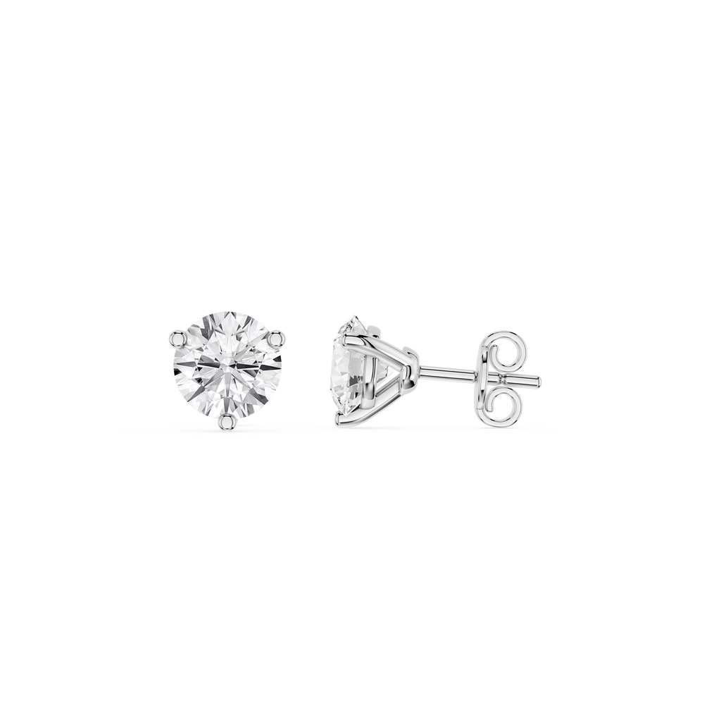 Four metallic brake pads on a white background