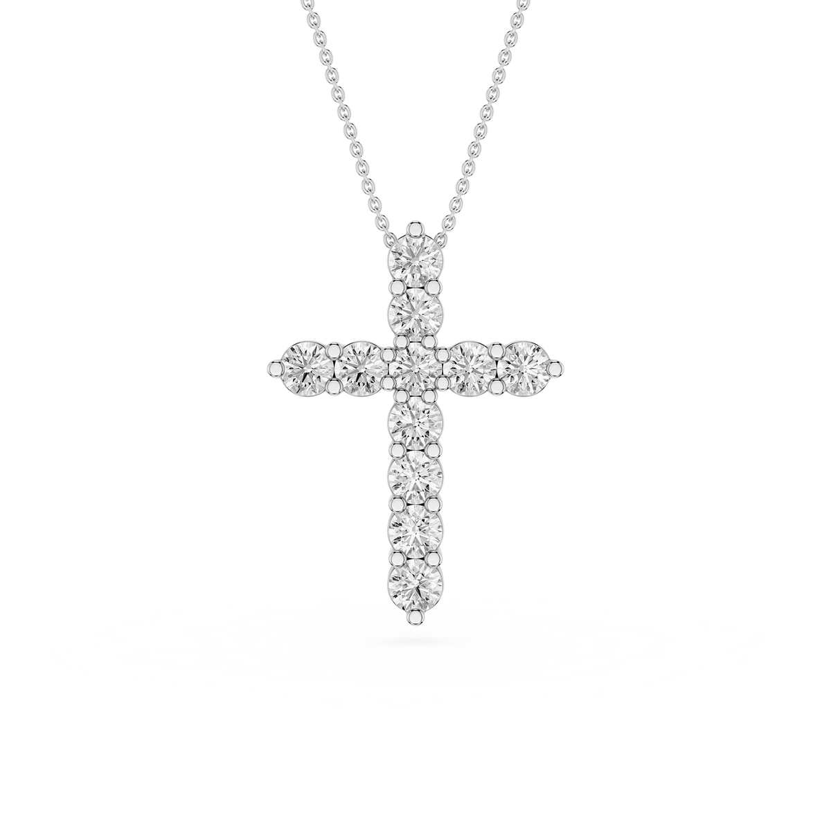 Silver cross pendant necklace on a white background