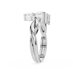 Silver ring with a twisted design on a white background