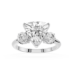 Diamond ring with a heart-shaped center stone on a white background