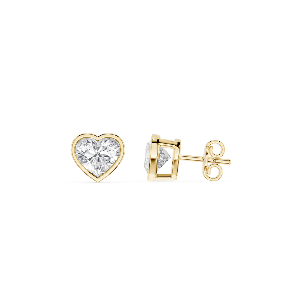Heart-shaped diamond earrings on a white background