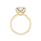 Gold ring with a clear gemstone on a white background
