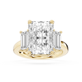 Yellow gold radiant cut lab grown diamond engagement ring featuring tapered baguette side stones and a polished band