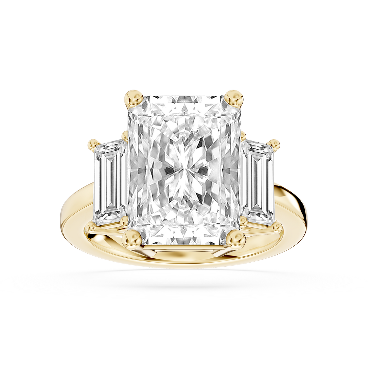 Yellow gold radiant cut lab grown diamond engagement ring featuring tapered baguette side stones and a polished band