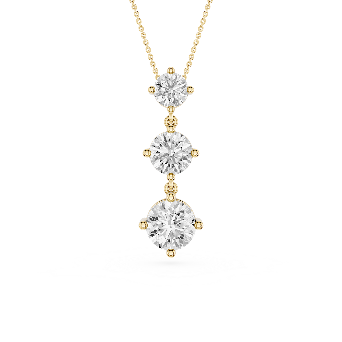 Three-tier diamond pendant on a gold chain against a white background