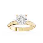 Gold ring with a large diamond on a white background