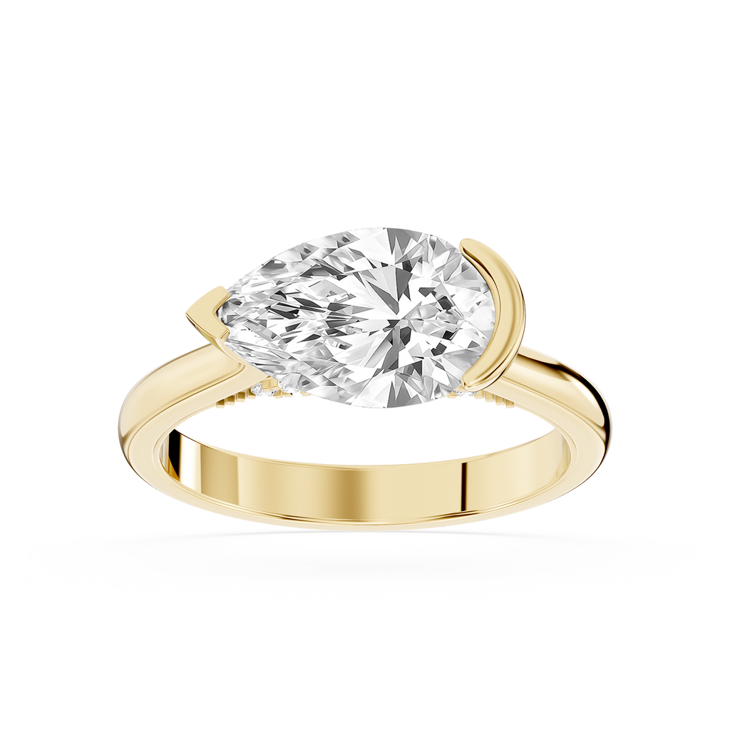 Yellow gold east west pear cut lab grown diamond engagement ring featuring a curved half bezel and polished band