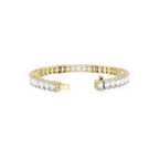 Gold bracelet with clear gemstones on a white background