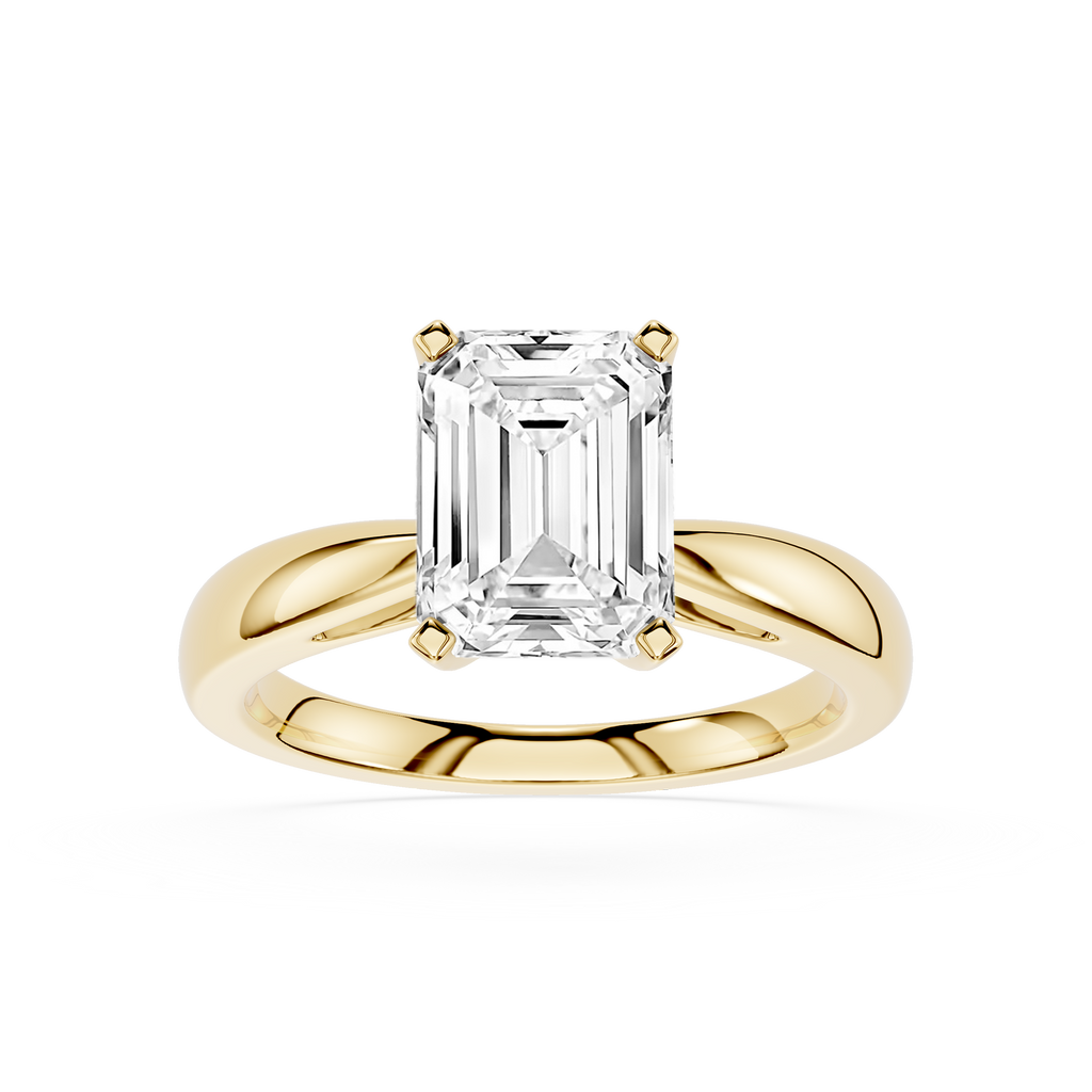 Gold ring with a large emerald-cut diamond on a white background