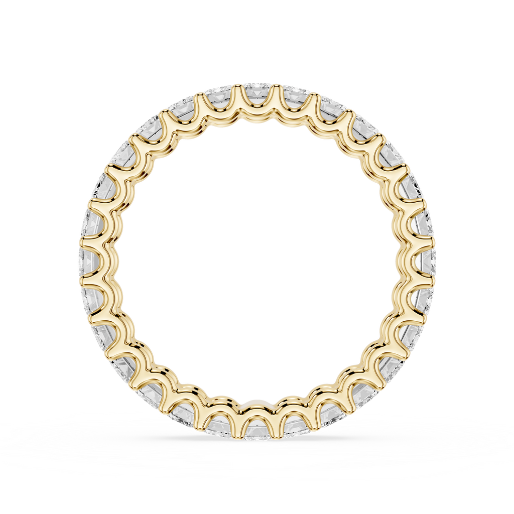 A yellow gold eternity ring featuring a continuous row of small, scalloped-cut clear gemstones, presented on a clean white background.