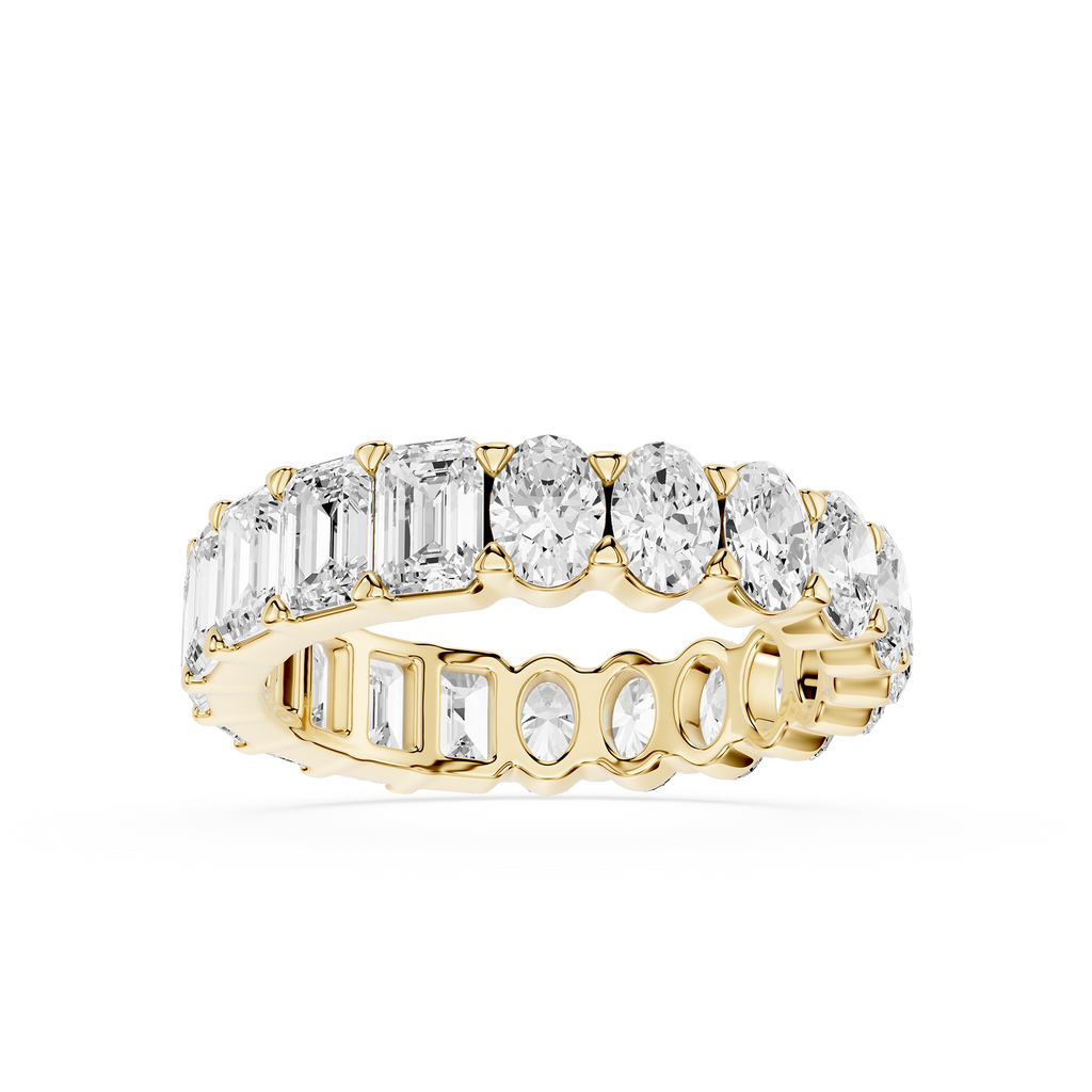 Gold ring with multiple diamonds on a white background
