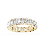 Gold ring with multiple diamonds on a white background