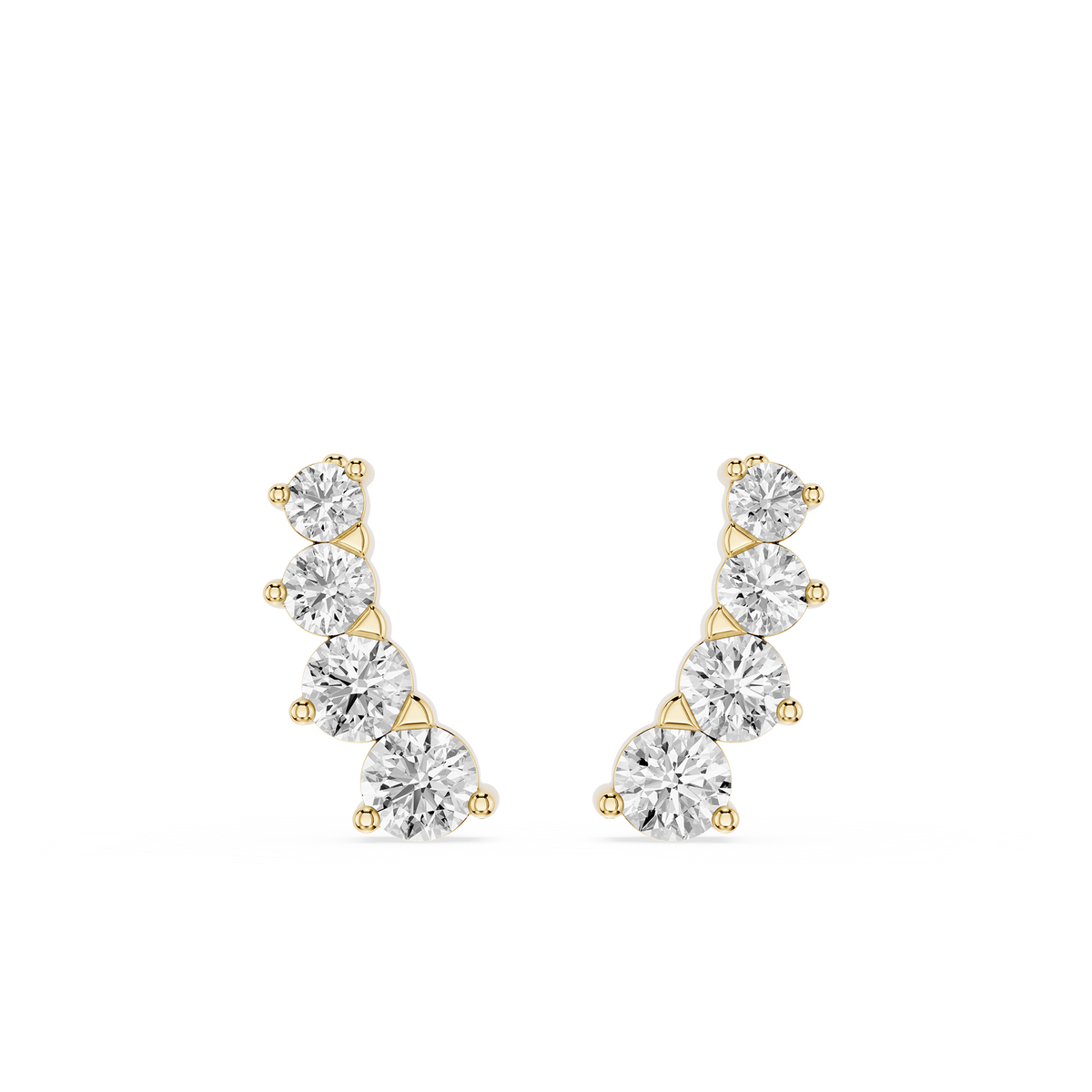Gold and silver earrings on a white background
