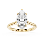 Gold ring with a pear-shaped diamond on a white background