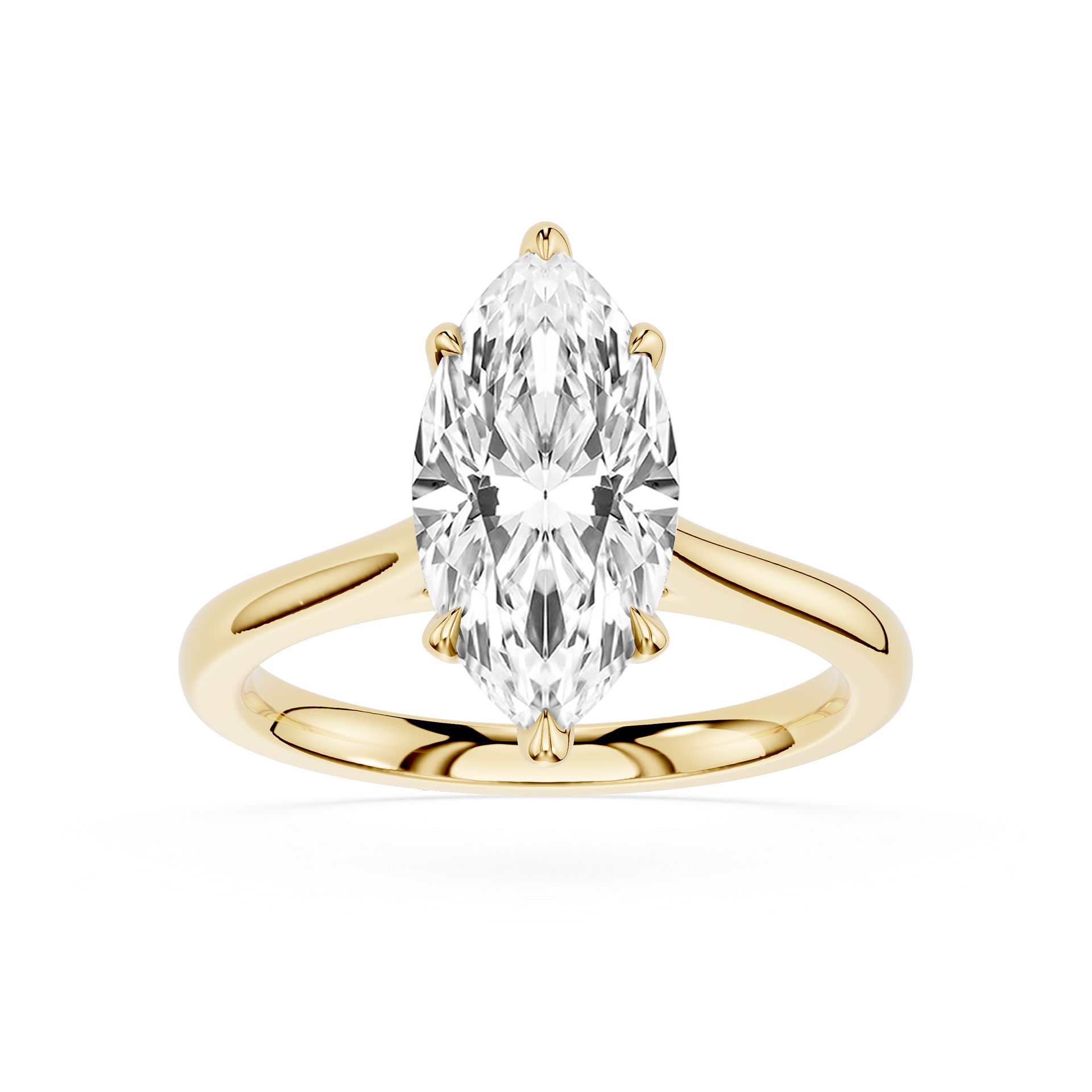 Gold ring with a pear-shaped diamond on a white background