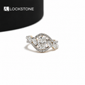 Yellow gold oval cut lab grown diamond engagement ring featuring smaller oval side stones and curved pavé diamond bands