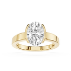Gold ring with a large diamond on a white background