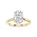 Gold ring with a large diamond on a white background