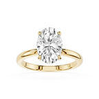 Gold ring with a large diamond on a white background
