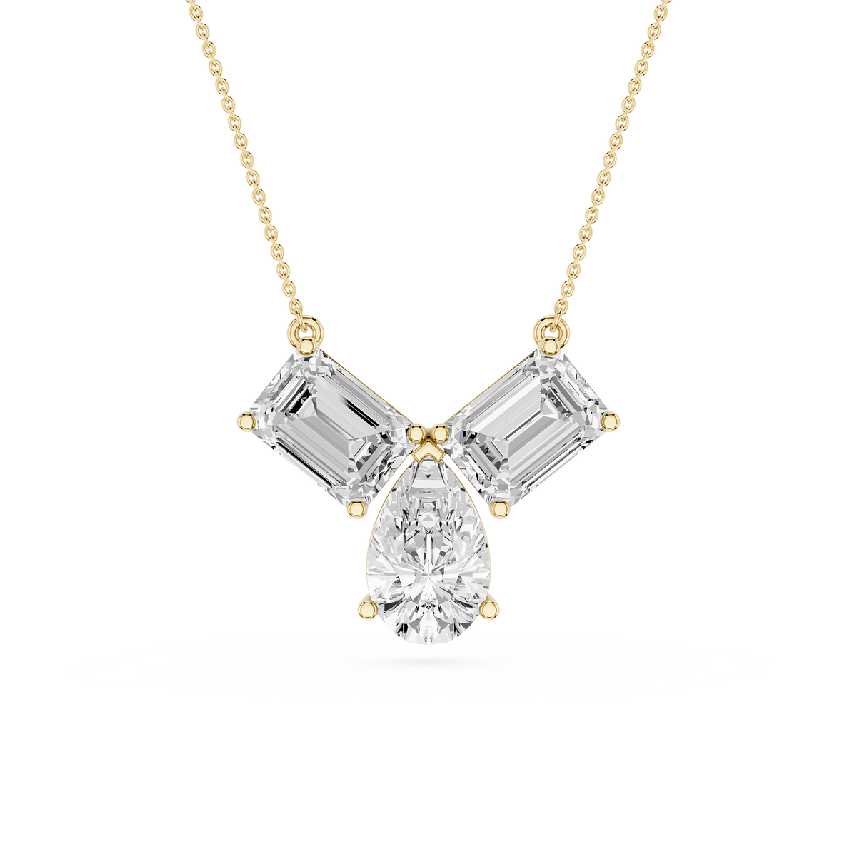 Diamond necklace with emerald-cut and pear-shaped stones on a white background