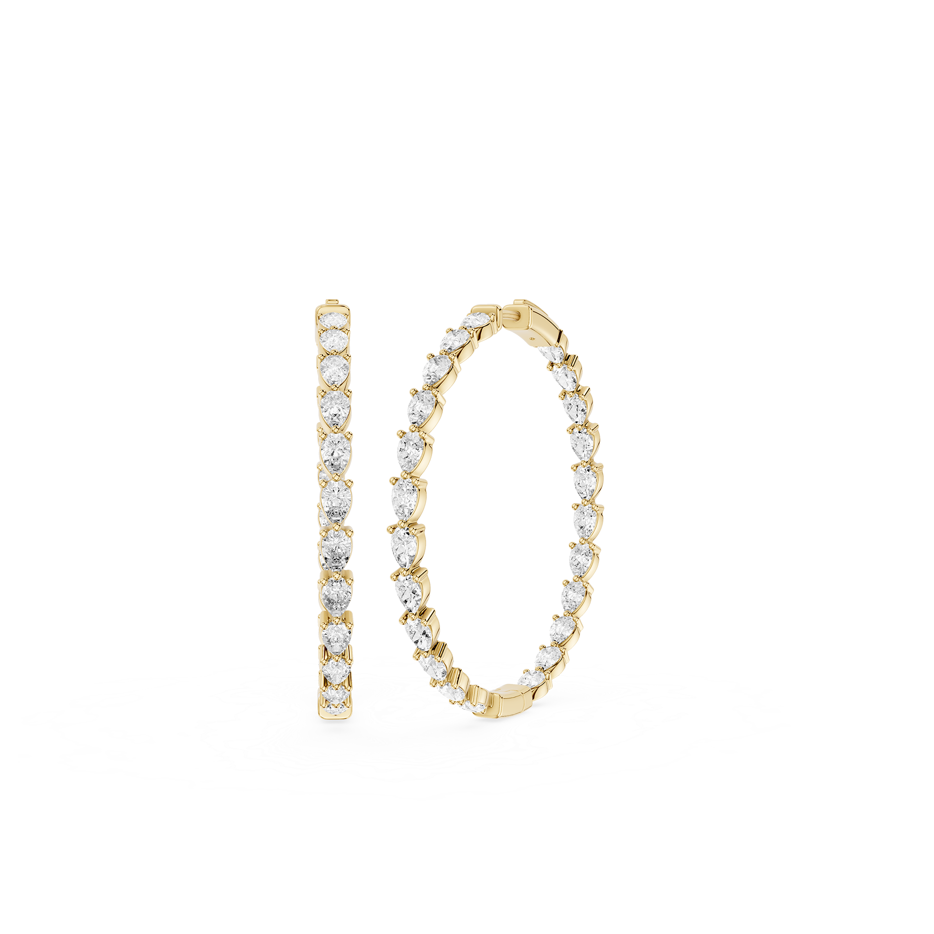 Gold hoop earrings with clear gemstones on a white background