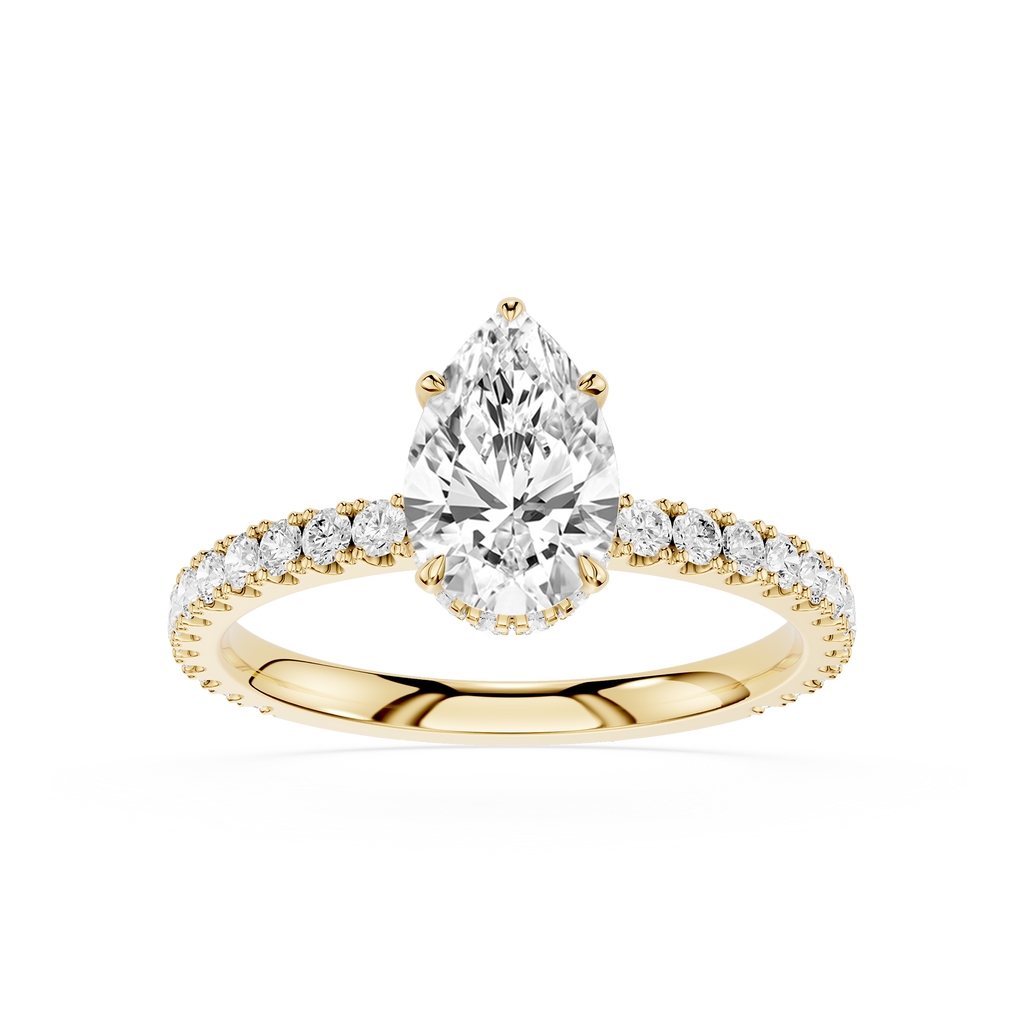 Gold ring with a pear-shaped diamond and smaller diamonds on a white background