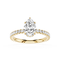 Gold ring with a pear-shaped diamond and smaller diamonds on a white background