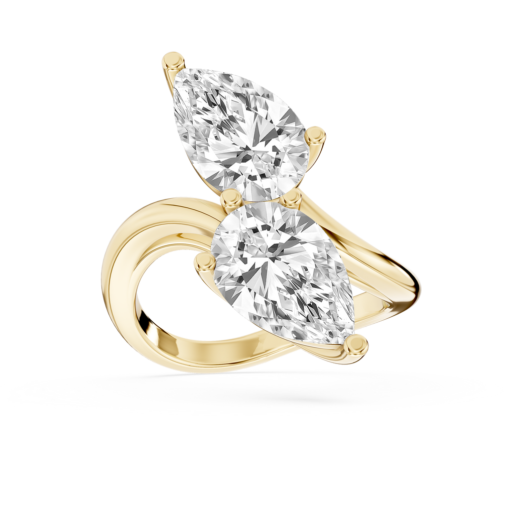 Yellow gold pear cut lab grown diamond Toi et Moi ring featuring two opposite facing stones on a polished bypass band