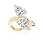 Yellow gold pear cut lab grown diamond Toi et Moi ring featuring two opposite facing stones on a polished bypass band