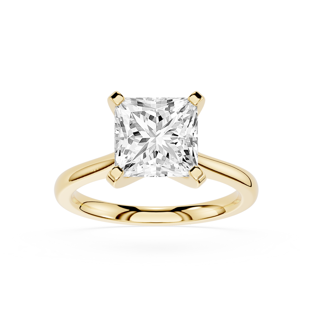 Gold ring with a large diamond on a white background