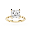 Gold ring with a large diamond on a white background