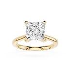 Gold ring with a large diamond on a white background