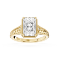 Yellow gold radiant cut lab grown diamond engagement ring featuring vintage filigree detailing and a milgrain border