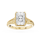 Yellow gold radiant cut lab grown diamond engagement ring featuring vintage filigree detailing and a milgrain border